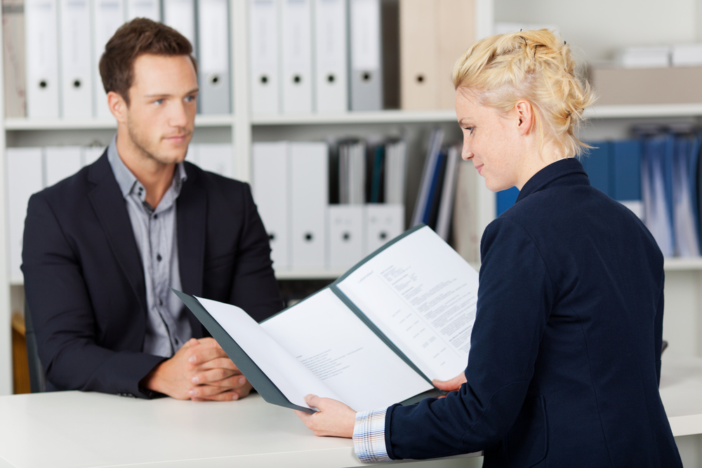 woman interviewing a man; connect with your interviewer